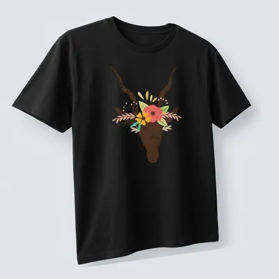 Boho floral illustration of a deer skull decorated with colorful flowers — printed on a unisex t-shirt (angled view)