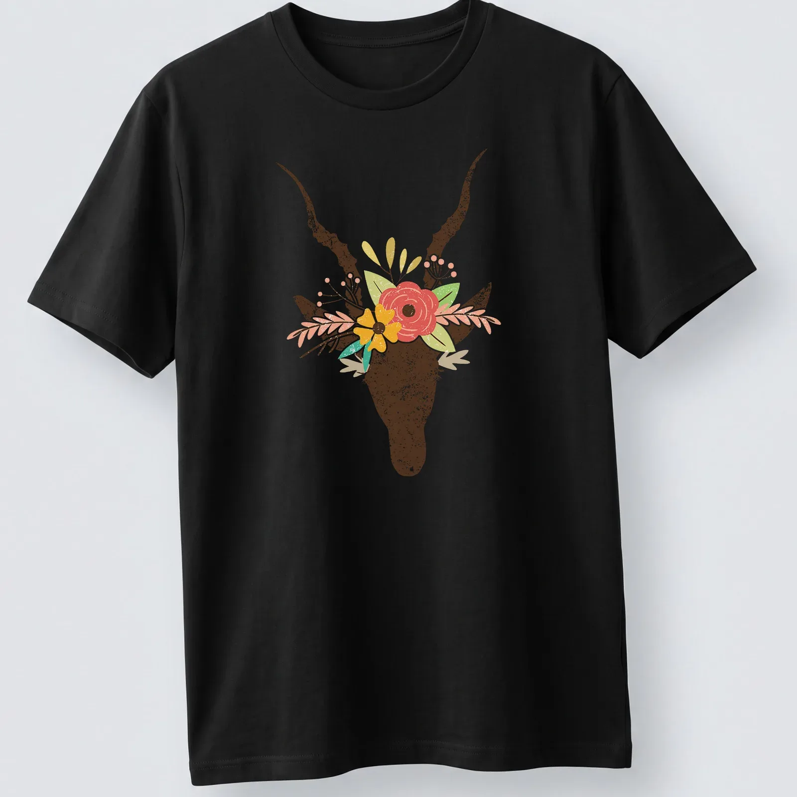 Boho floral illustration of a deer skull decorated with colorful flowers — printed on a unisex t-shirt