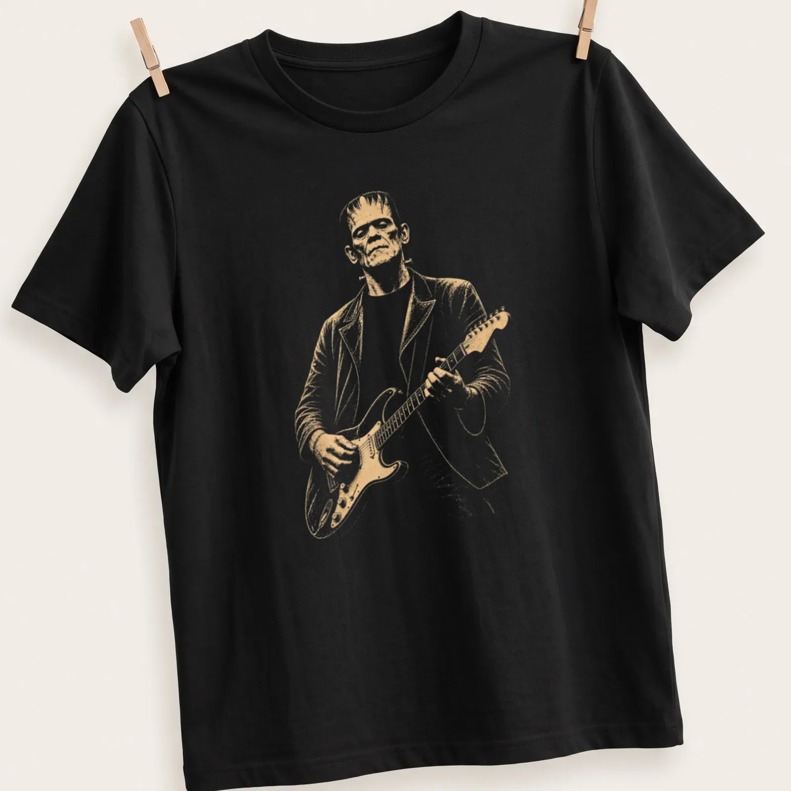 Vintage style Frankenstein playing guitar in white, gold, and black — printed on a unisex t-shirt