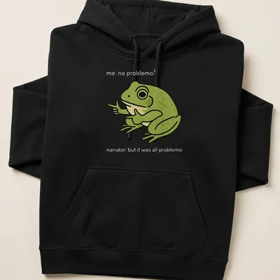 Cartoon frog meme t-shirt with the text 'me, no problemo!' underneath — printed on a unisex hoodie