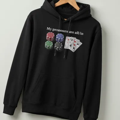 Distressed t-shirt featuring poker chips and cards with the text 'My pronouns are all/in.' — printed on a unisex hoodie