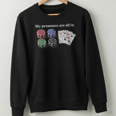 Distressed t-shirt featuring poker chips and cards with the text 'My pronouns are all/in.' — printed on a unisex sweatshirt