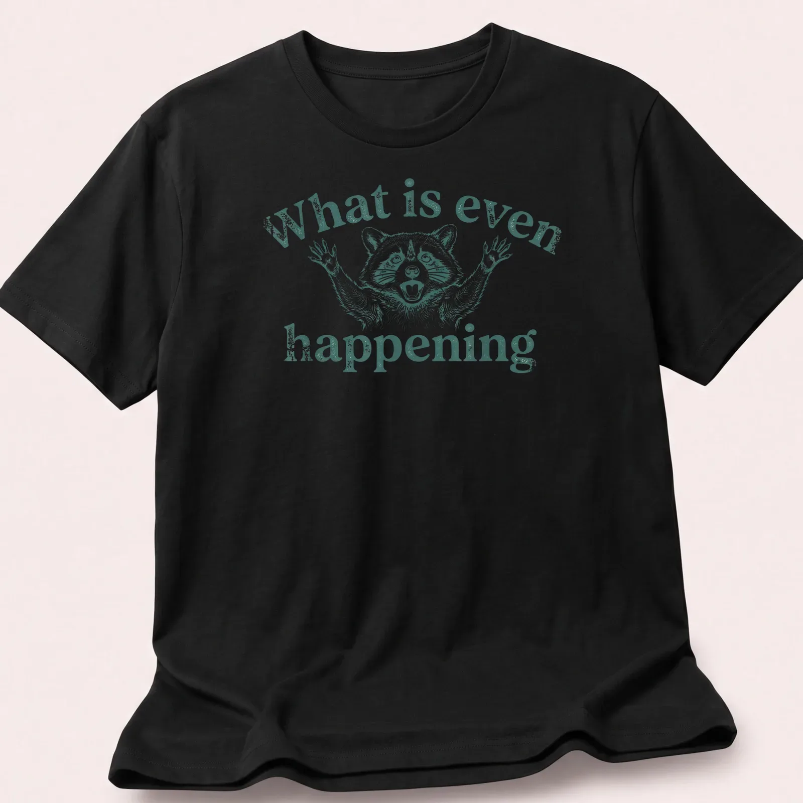Vintage illustration of a puzzled raccoon with text 'What is even happening' — printed on a unisex t-shirt