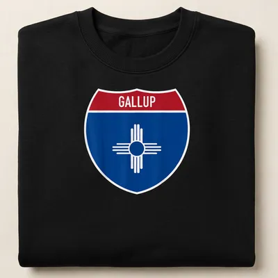 Bold graphic of Gallup highway sign in blue, red, and white — printed on a unisex sweatshirt