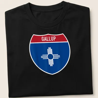 Bold graphic of Gallup highway sign in blue, red, and white — printed on a unisex t-shirt