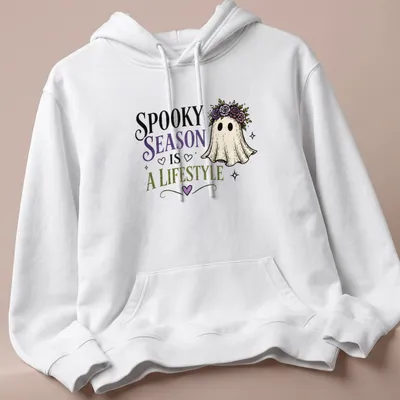 Whimsical ghost with floral crown and colorful text celebrating spooky season. — printed on a unisex hoodie