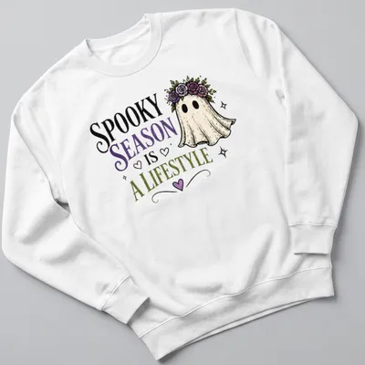 Whimsical ghost with floral crown and colorful text celebrating spooky season. — printed on a unisex sweatshirt