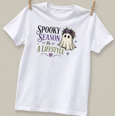 Whimsical ghost with floral crown and colorful text celebrating spooky season. — printed on a unisex t-shirt