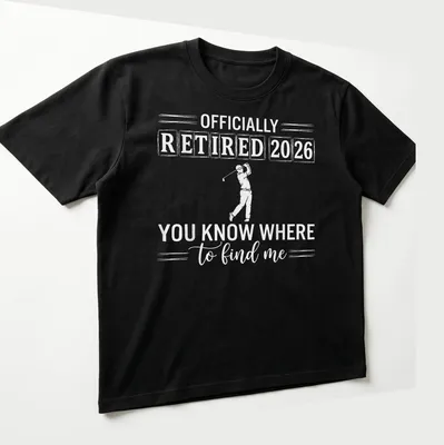 Bold typography design stating 'OFFICIALLY RETIRED 2026 YOU KNOW WHERE to find me' with golfer theme — printed on a unisex t-shirt (angled view)
