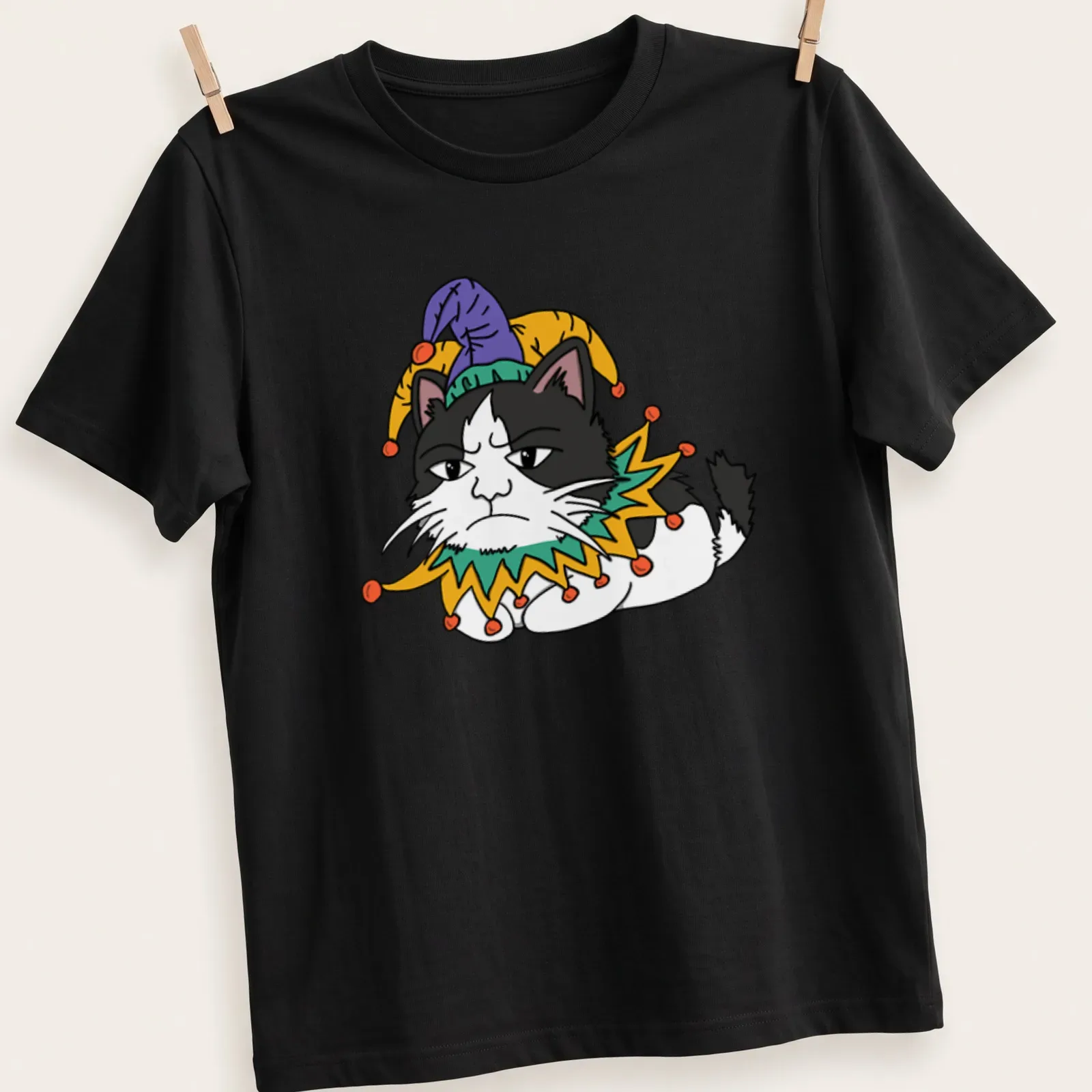 Cartoon Grumpy Cat wearing a jester hat in black, white, green, yellow, and purple — printed on a unisex t-shirt
