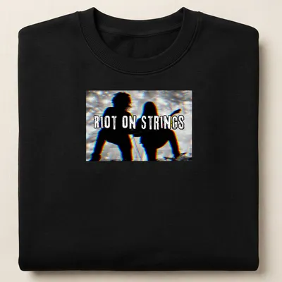 Grunge style T-shirt with silhouettes of guitar players and the text Riot On Strings — printed on a unisex sweatshirt