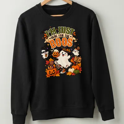 Kawaii illustration of a friendly ghost with pumpkins and candy saying I'm Just Here For The Boos — printed on a unisex sweatshirt