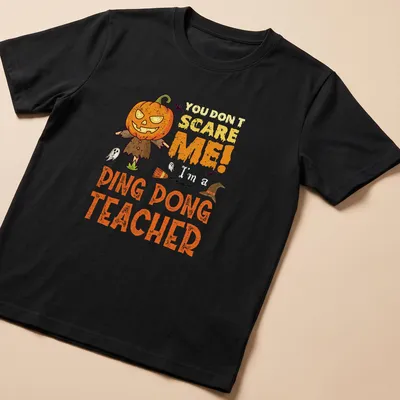 Cartoon pumpkin character with humorous text 'You Don't Scare Me! Ping Dong Teacher' in orange and black