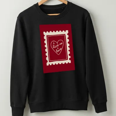 Retro heart stamp graphic with text 'i live so i love' in red and cream. — printed on a unisex sweatshirt
