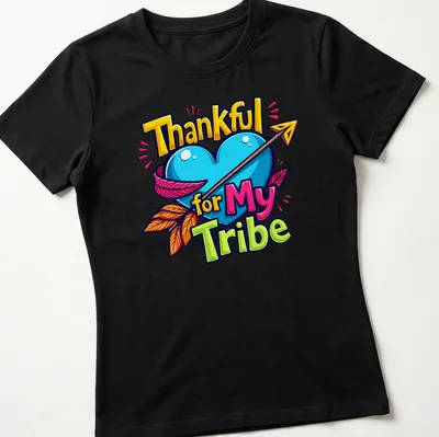 Colorful cartoon heart with arrow and text 'Thankful for My Tribe' — printed on a women's shirt