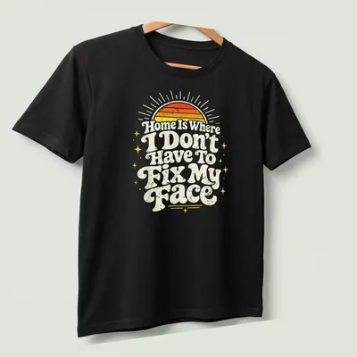 Retro distressed shirt with sunrise and text about comfort at home — printed on a unisex t-shirt (angled view)