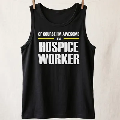 Bold typography shirt reading 'Of Course I’m Awesome I’m Hospice Worker' in black, yellow, and white — printed on a tank top