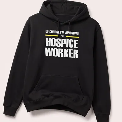 Bold typography shirt reading 'Of Course I’m Awesome I’m Hospice Worker' in black, yellow, and white — printed on a unisex hoodie