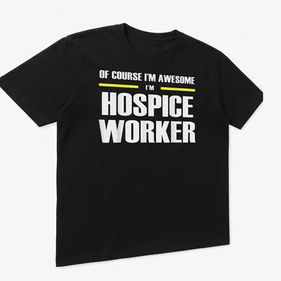 Bold typography shirt reading 'Of Course I’m Awesome I’m Hospice Worker' in black, yellow, and white — printed on a unisex t-shirt (angled view)