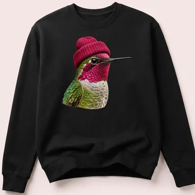 Realistic hummingbird wearing a beanie in green, pink, and white — printed on a unisex sweatshirt