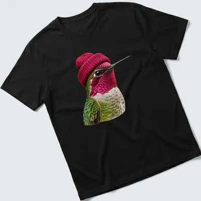 Realistic hummingbird wearing a beanie in green, pink, and white