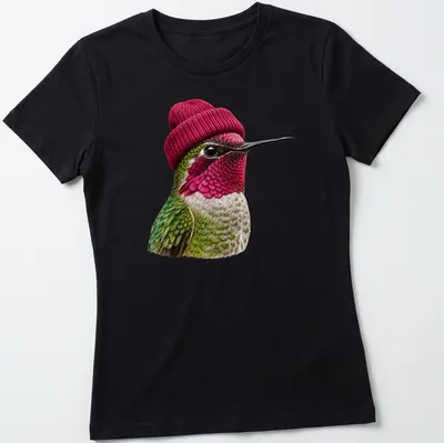 Realistic hummingbird wearing a beanie in green, pink, and white — printed on a women's shirt