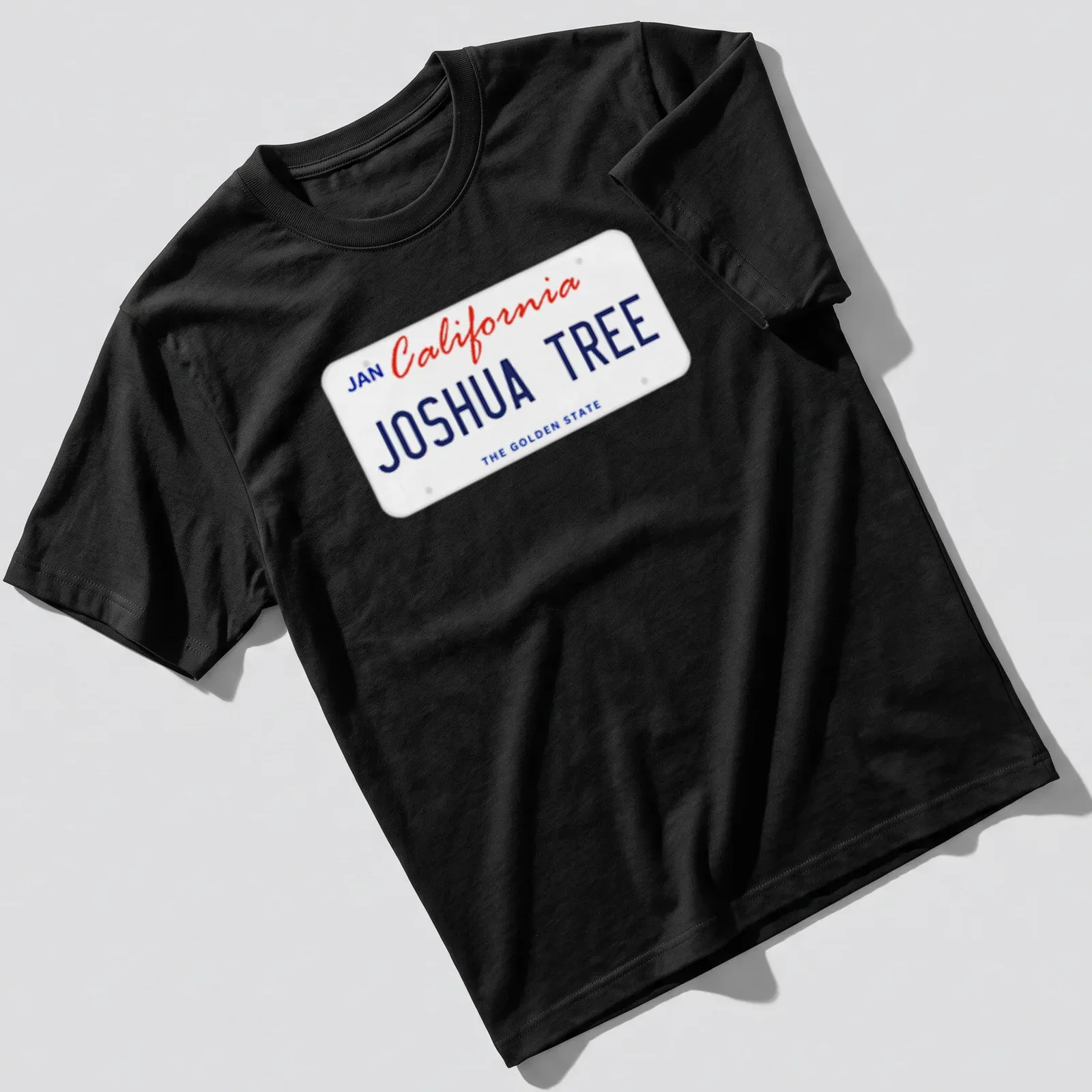 Vintage California license plate design featuring Joshua Tree in blue and red — printed on a unisex t-shirt