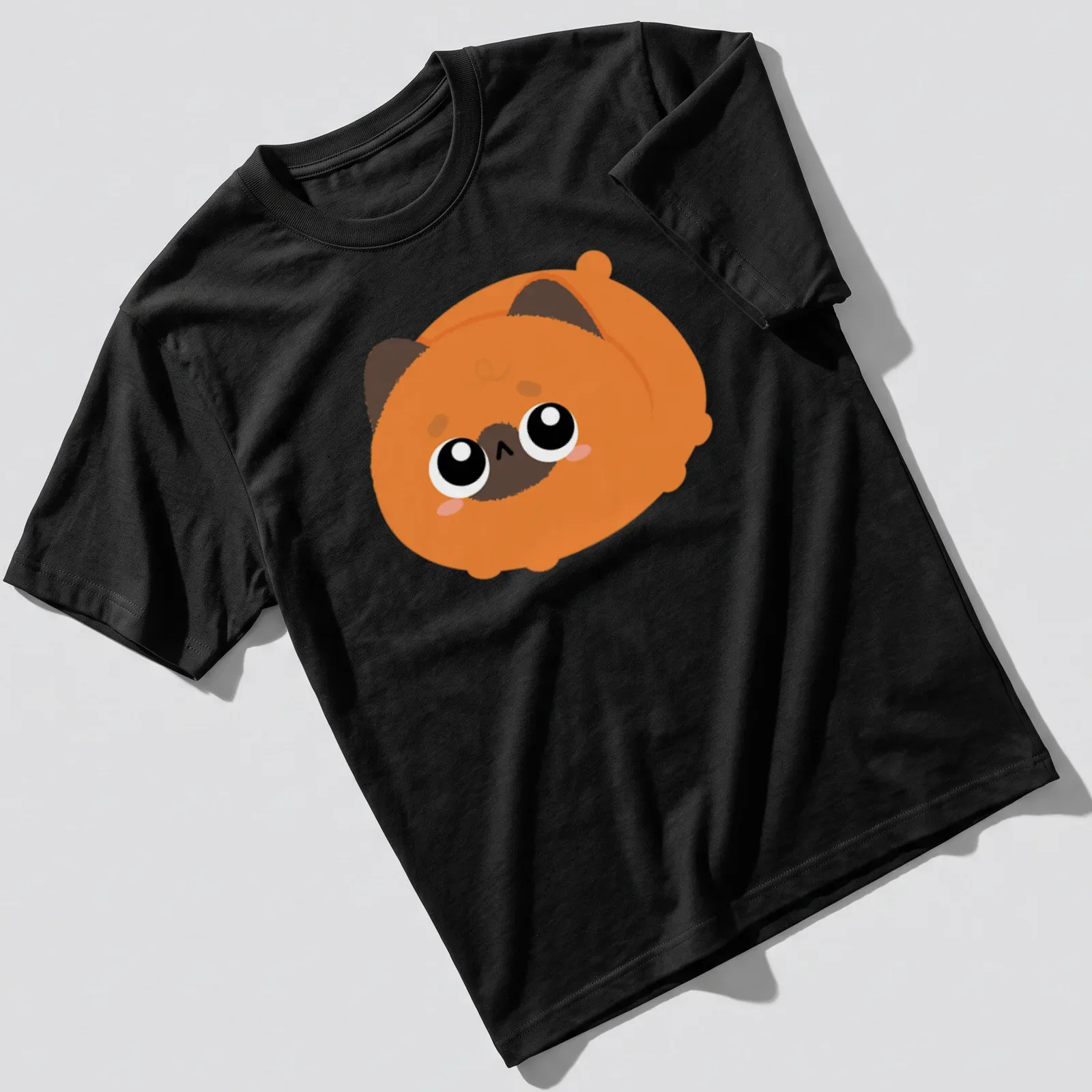 Kawaii orange cat graphic with big eyes in orange, brown, black, and white — printed on a unisex t-shirt