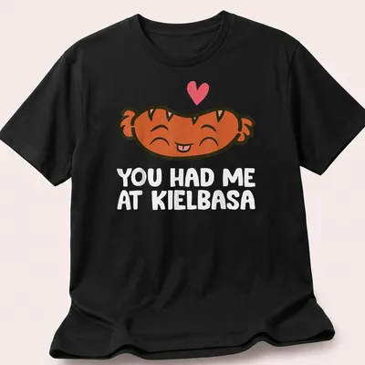 Kawaii t-shirt featuring a smiling kielbasa with playful text above.