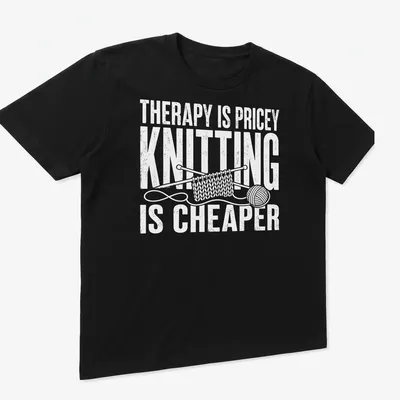Bold typography t-shirt with humorous knitting statement in white — printed on a unisex t-shirt (angled view)