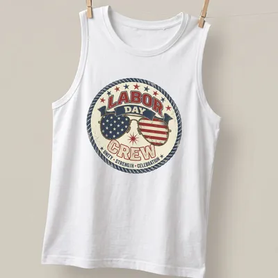 Vintage distressed shirt featuring sunglasses with American flags and bold text about Labor Day — printed on a tank top