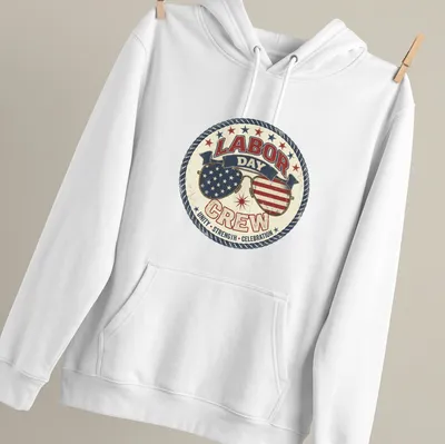 Vintage distressed shirt featuring sunglasses with American flags and bold text about Labor Day — printed on a unisex hoodie