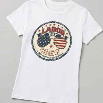 Vintage distressed shirt featuring sunglasses with American flags and bold text about Labor Day — printed on a women's shirt