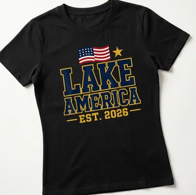 Bold patriotic Lake America t-shirt with the year 2026 in bright colors — printed on a women's shirt