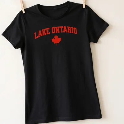Bold Lake Ontario print with a maple leaf in striking red — printed on a women's shirt