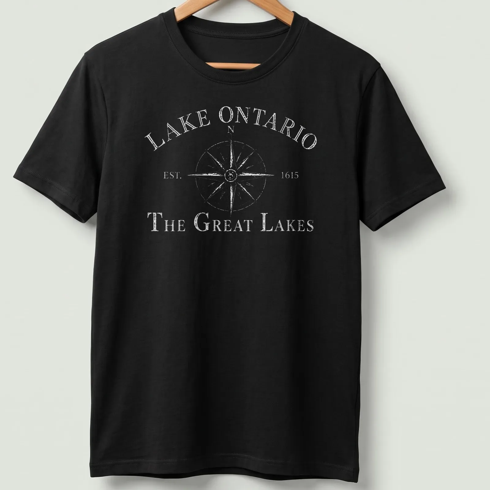 Vintage compass design featuring Lake Ontario history in black and white. — printed on a unisex t-shirt