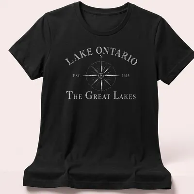 Vintage compass design featuring Lake Ontario history in black and white. — printed on a women's shirt