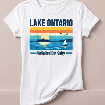 Retro vintage design of a sailboat on Lake Ontario at sunset with various colors — printed on a women's shirt