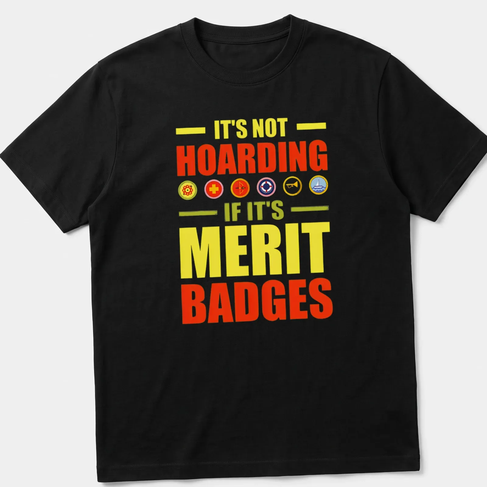 Bold typography T-shirt with colorful text about merit badges. — printed on a unisex t-shirt