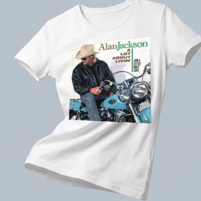 Vintage Alan Jackson tee featuring a motorcycle and lyrics in earthy tones — printed on a women's shirt