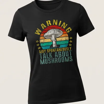 Retro distressed tee featuring a colorful mushroom and humorous warning text — printed on a women's shirt