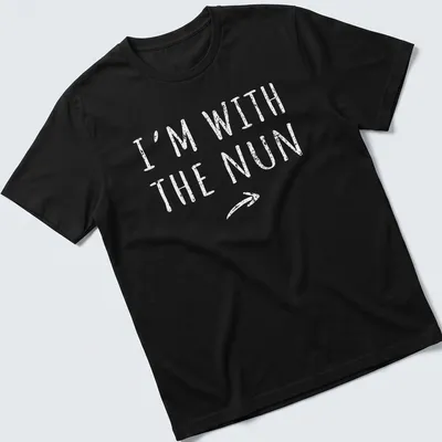Bold printed text I'm With The Nun on a white t-shirt with a nun graphic