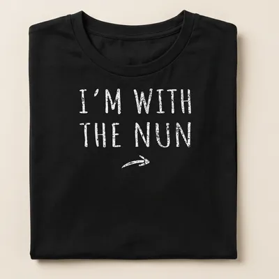 Bold printed text I'm With The Nun on a white t-shirt with a nun graphic — printed on a women's shirt