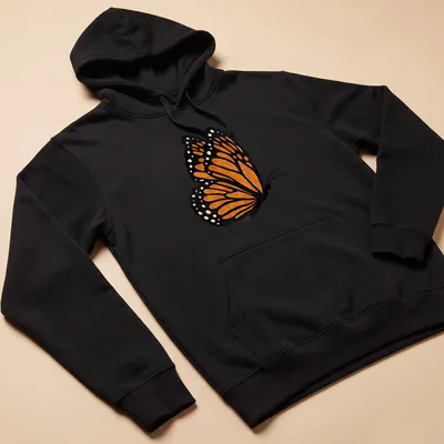 Watercolor print of an orange butterfly with intricate wings on a — printed on a unisex hoodie