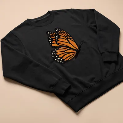 Watercolor print of an orange butterfly with intricate wings on a — printed on a unisex sweatshirt