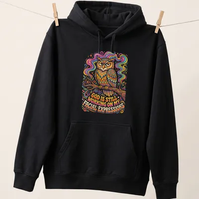 Colorful whimsical illustration of an owl with text about facial expressions — printed on a unisex hoodie