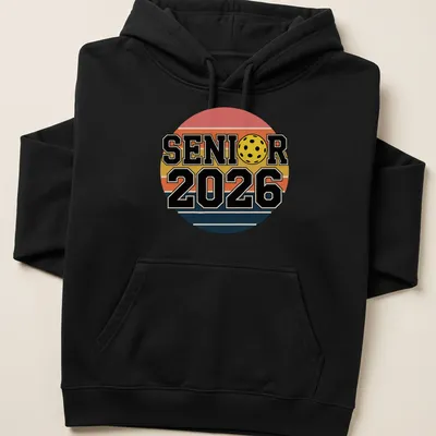 Retro pickleball graduation shirt with bold text and colorful graphics — printed on a unisex hoodie
