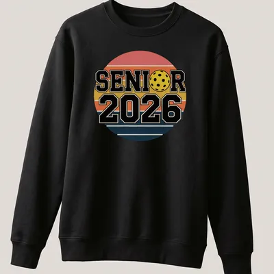 Retro pickleball graduation shirt with bold text and colorful graphics — printed on a unisex sweatshirt