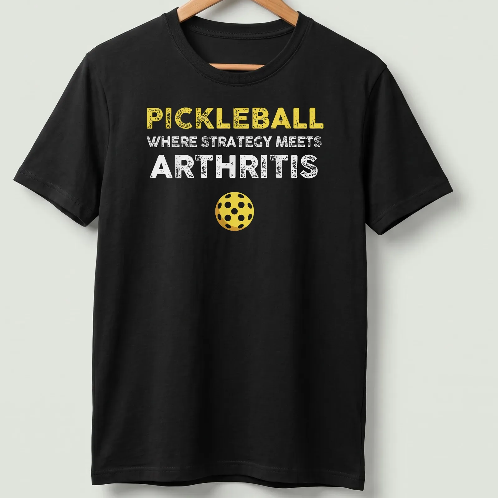 Bold and playful Pickleball humor shirt with yellow, white, and brown text — printed on a unisex t-shirt