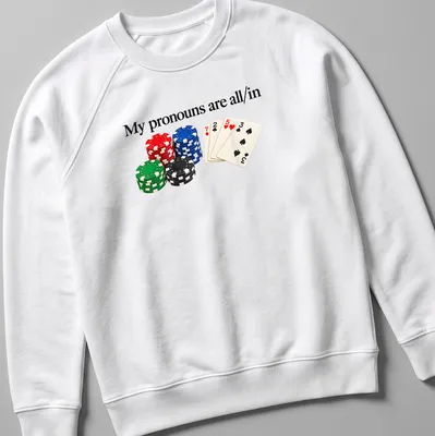 Graphic tee featuring poker chips and playing cards with bold text about pronouns — printed on a unisex sweatshirt
